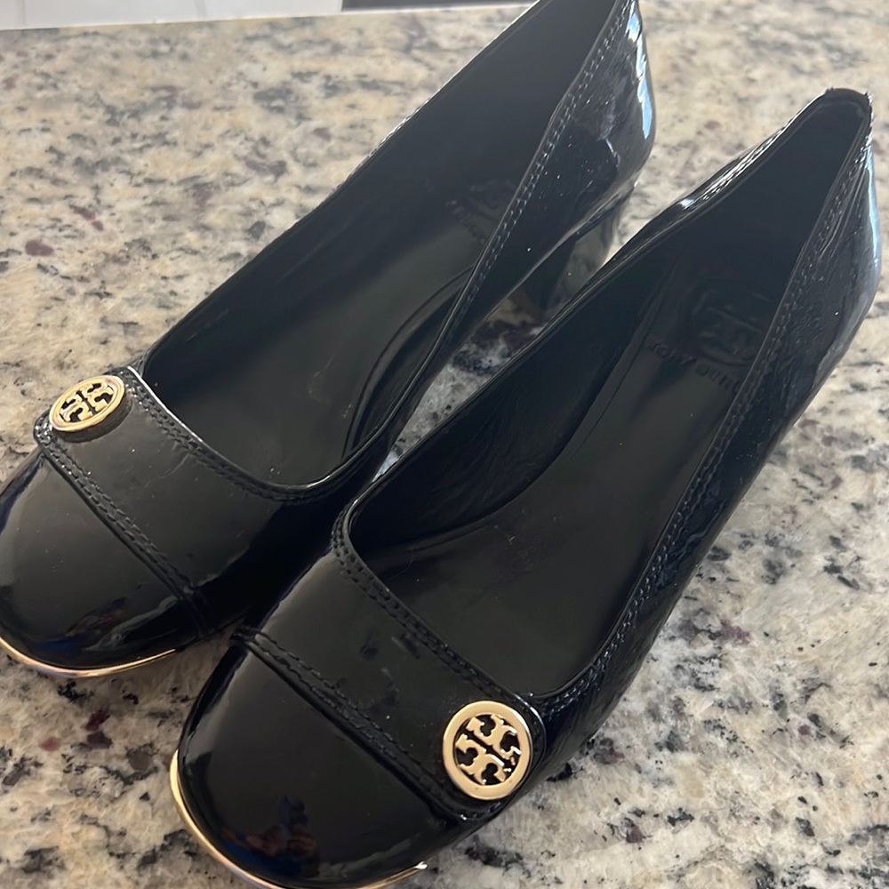 Gently worn TB block heel pump